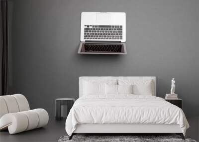 Laptop over gray table overhead image Wall mural