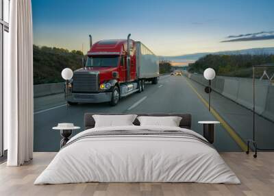 Semi truck on highway at sunset Wall mural