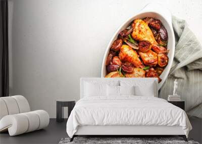 Baked chicken legs, drumsticks with figs and red onions in balsamic marinade in ceramic baking dish, white background, top view Wall mural