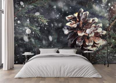 Christmas or New Year blurred snow background with festive fir tree and pine cones, selective focus Wall mural