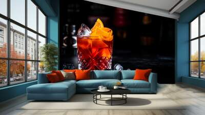 Coffee negroni red cocktail drink with dry gin, vermouth and bitter, espresso, liqueur, orange and ice. Black bar counter background Wall mural