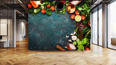 Fresh healthy food cooking or salad making ingredients on dark background with rustic wooden board. Diet or vegetarian food concept. Top view, copy space Wall mural