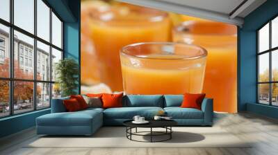 Fresh tangerine juice with slices of mandarin on old wooden back Wall mural