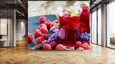 Hot red tea with raspberries, mint and rose petals, selective fo Wall mural