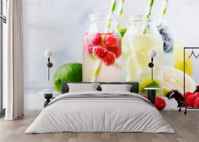 Summer drinks set. Berry, fruit and citrus non-alcoholic refreshing ice cold beverages and cocktails in glass bottles on white background Wall mural