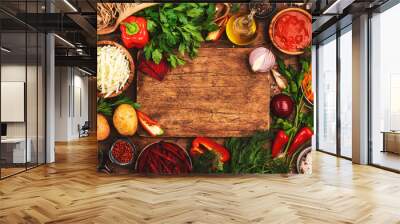 Various uncooked vegetables, herbs and spices for healthy cooking and cutting board on rustic kitchen wooden table, top view. Preparation vegetarian cabbage, beetroot, tomato soup. Vegan, balanced Wall mural