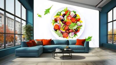 Vegan vegetable salad with olives, tomato, paprika, cucumber and onion, healthy mediterranean food. White background, top view Wall mural