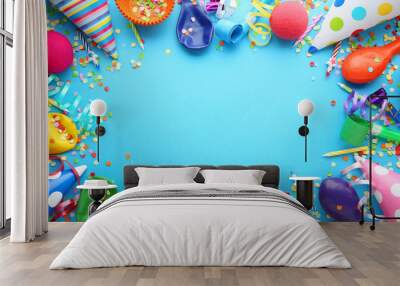 Birthday party caps, blowers and candles on blue background Wall mural