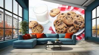 Chocolate chip cookies with glass of milk on white wooden table Wall mural