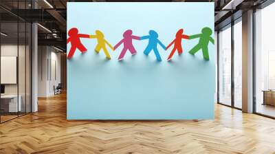 Colorful paper chain people on blue background Wall mural