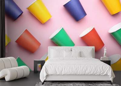 Colorful paper cups on pink background Wall mural