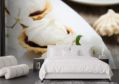 French meringue cookies in tartlet on plate on grey wooden backg Wall mural