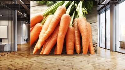 Fresh and sweet carrot on a grey wooden table Wall mural