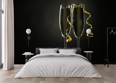 Glasses of champagne on a black background Wall mural