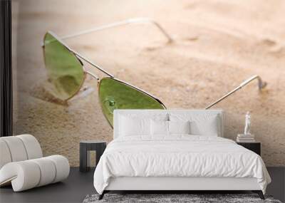 Modern sunglasses on the beach sand Wall mural