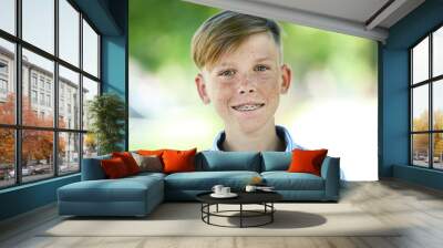 Portrait of young boy in the park Wall mural