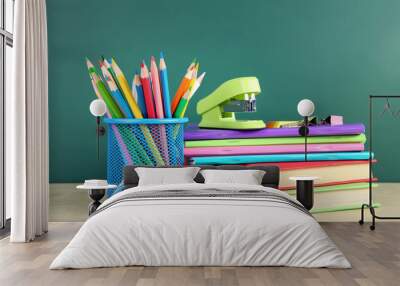 School supplies with books and notebooks on chalkboard background Wall mural