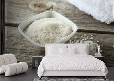 Sea salt in white bowl on grey wooden background Wall mural