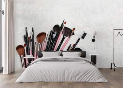 Set of makeup brushes on grey background Wall mural