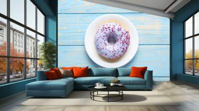 sweet donuts on blue wooden table Wall mural