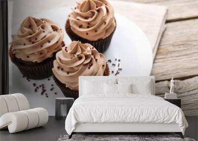 Tasty cupcakes on a grey wooden table Wall mural