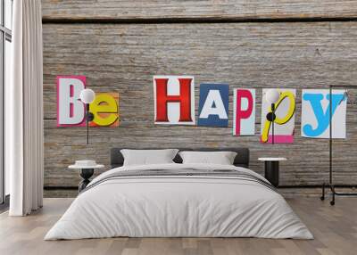 The word be happy in cut out magazine letters Wall mural