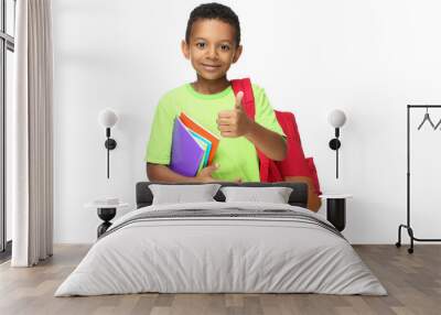 Young African American school boy with notepads and backpack on white background Wall mural