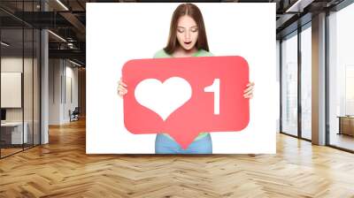 Young woman holding paper card with heart and number one on white background Wall mural