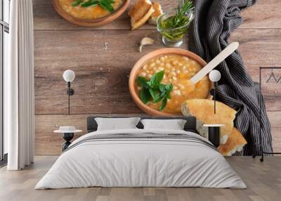 Served traditional hot beans soup with corn bread, garlic and olive oil. Vegetarian healthy dish, vegan food Wall mural