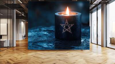 A glowing black candle with a pentagram symbol, radiating an eerie light, set against a dark and mystical backdrop Wall mural