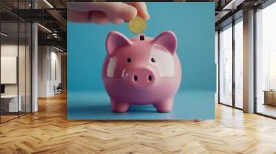 A large pink piggy bank with tiny toy coins being inserted, representing early lessons on saving for children Wall mural