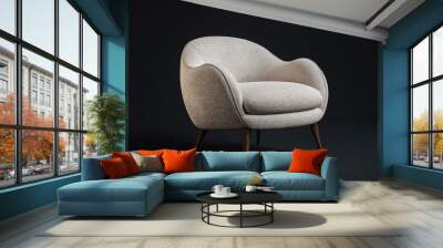 A modern armchair with a curved design and textured fabric, wooden legs enhancing the minimalist aesthetic against a dark background. Wall mural