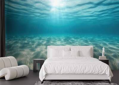 A serene underwater scene of a sandy seabed, with clear tropical ocean water above and sunlight creating shimmering ripples. Wall mural