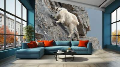 Agile mountain goat climbing steep rocky cliffs with ease Wall mural