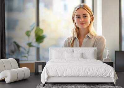 Businesswoman in her office, casually posed by her desk with natural light from the window, corporate photography emphasizing professionalism. Wall mural