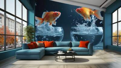 Goldfish in mid-air leap from a small bowl to a larger one, water splashing all around in a concept of limitless adventure. Wall mural