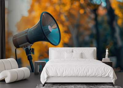 Image of a megaphone in use at a protest, background blurred, symbolizing the amplified voice of activists. Wall mural