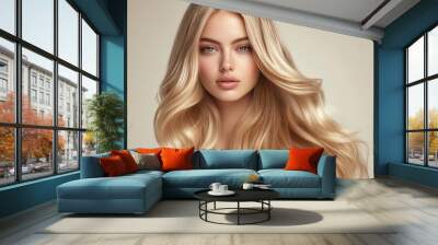 Stunning blonde woman with long, shiny wavy hair, styled to perfection. Her glowing skin and natural makeup complete the look. Wall mural