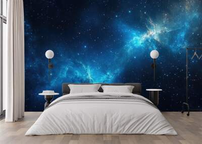 Stunning blue galaxy background filled with twinkling stars and glowing nebulae, creating a mesmerizing cosmic scene in deep space Wall mural