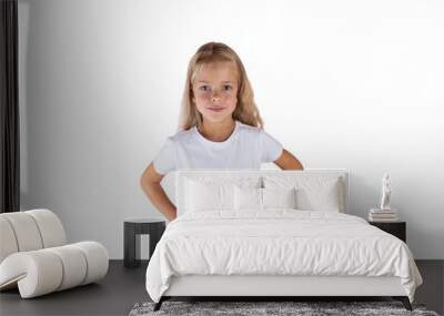 Beautiful girl with blond hair in a T-shirt isolated on a white background. Wall mural