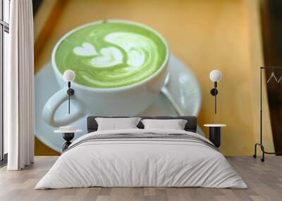 hot matcha green tea latte on wood table. Wall mural