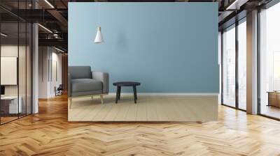 Minimal concept. interior of living grey fabric armchair, ceiling lamp and black table on wooden floor and blue wall. Wall mural