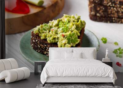 Toast with dip avocado - guacamole sauce, rye bread Wall mural