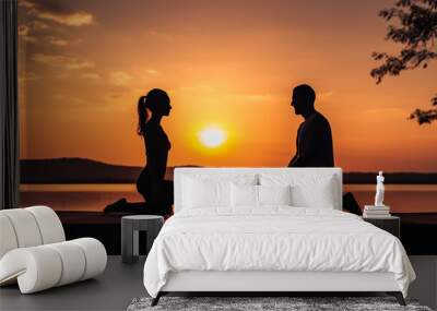 dark silhouette image of a husband wife doing yoga .  Wall mural