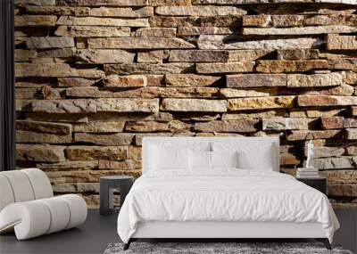 Background of stone wall texture. The surface of the stones is brown Wall mural