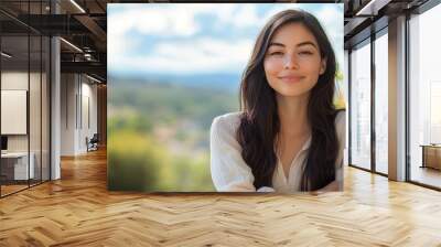 beautiful young woman smiling facing the camera with her arms crossed Wall mural