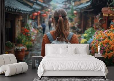 Woman exploring a beautiful Chinese village Wall mural