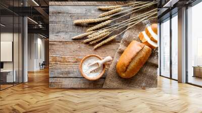 baking bread with wheat flour and ears on table rystic background top view mockup Wall mural