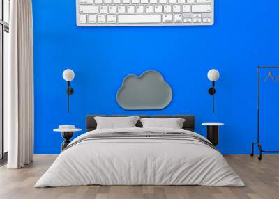 cloud service concept with clouds and keyboard on blue background top view Wall mural