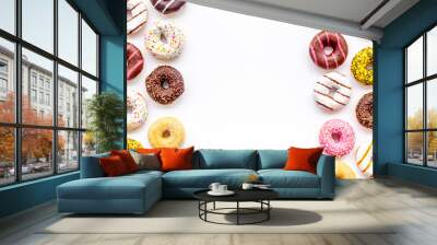 Glazed decorated donuts for sweet break on white background flat lay copy space Wall mural